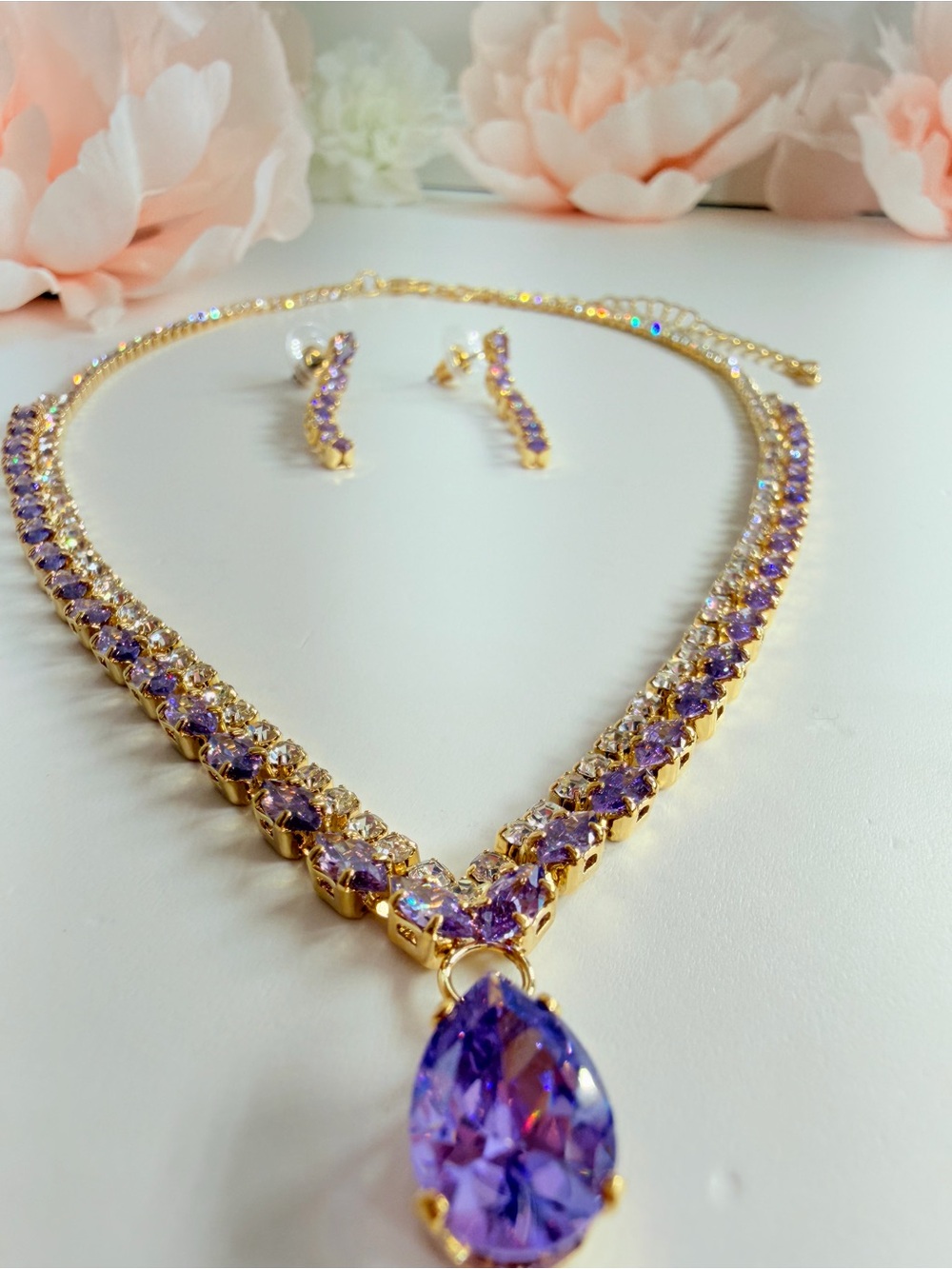 Purple and gold jewelry set with purple and clear crystal